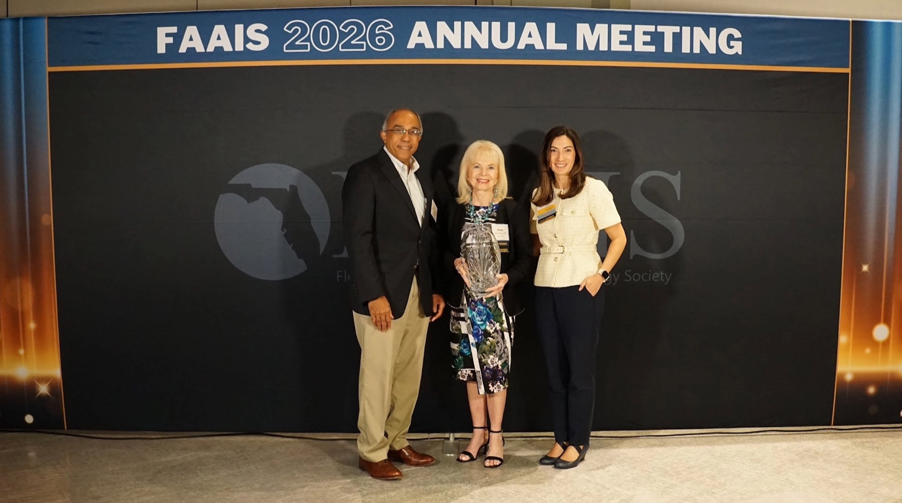 Dana Wallace receiving the 2026 FAAIS Lifetime Achievement Award