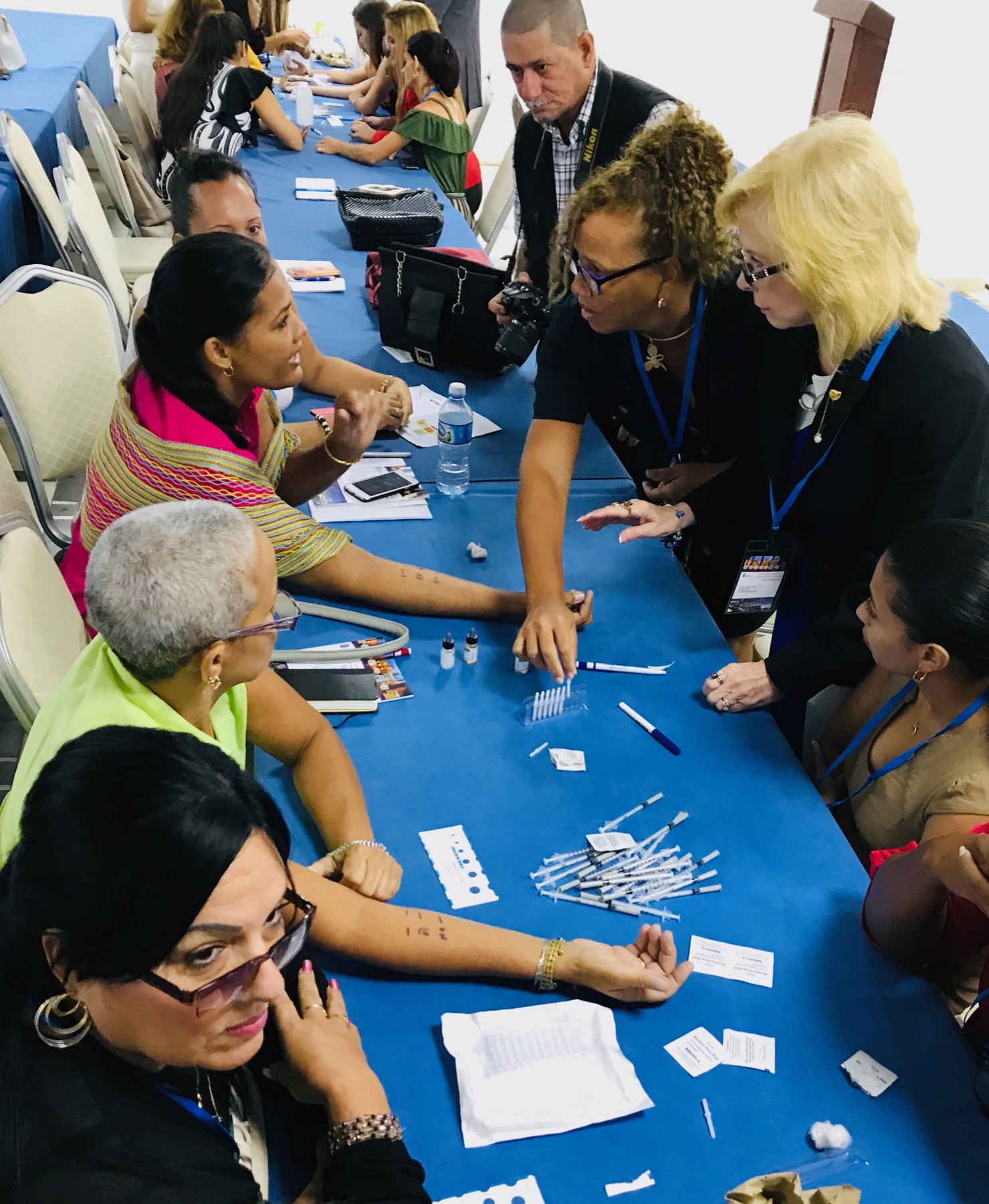 Dana Wallace teaching an allergy skin testing workshop in Cuba in 2019